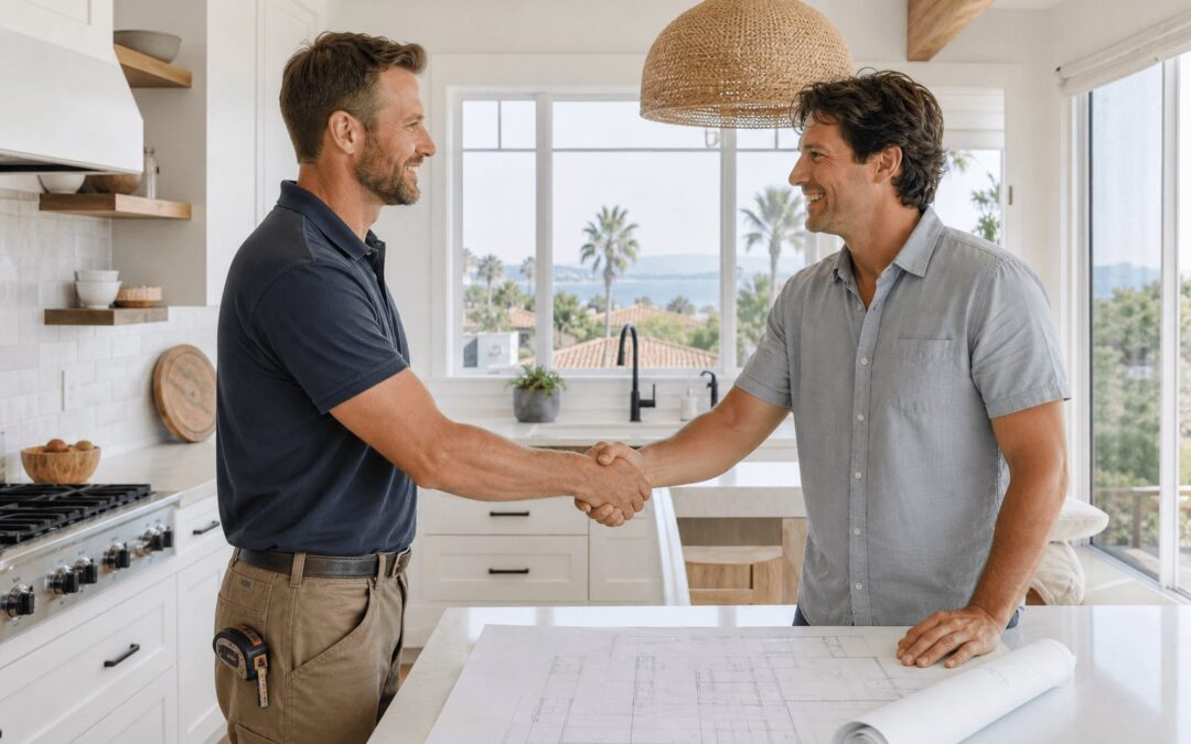 Licensed general contractor shaking hands with a homeowner while reviewing remodeling plans at a bright Santa Barbara home